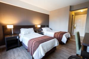 Postel nebo postele na pokoji v ubytování Hotel Crans Montana