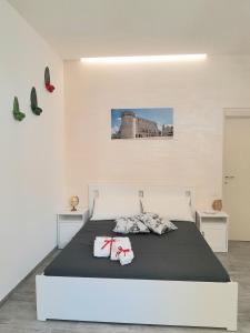 Postel nebo postele na pokoji v ubytování Dimora Pié del Castello