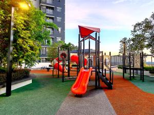 a playground with a slide in a park at Alanis Residence 7 Pax @ Sepang KLIA Kota Warisan in Sepang