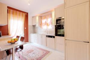 A kitchen or kitchenette at Prime Luxury Villa beach front