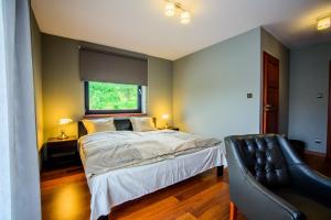 Katil atau katil-katil dalam bilik di Otulina Park