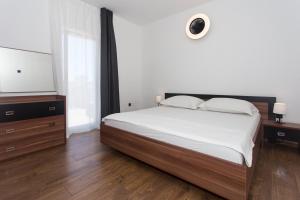 Postel nebo postele na pokoji v ubytování Angolo Apartments