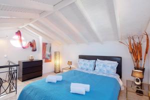 A bed or beds in a room at Prime Luxury Villa beach front