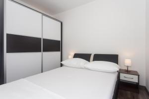 Postel nebo postele na pokoji v ubytování Angolo Apartments