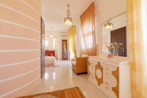 A bed or beds in a room at Prime Luxury Villa beach front