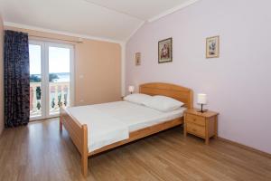 Postel nebo postele na pokoji v ubytování Angolo Apartments