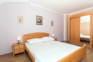 Postel nebo postele na pokoji v ubytování Angolo Apartments