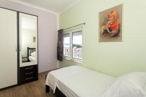 Postel nebo postele na pokoji v ubytování Angolo Apartments