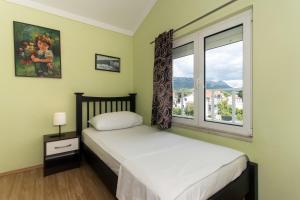 Postel nebo postele na pokoji v ubytování Angolo Apartments