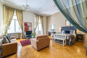 a living room with a bed and a couch at SUPER CHIC with Balcony in Budapest