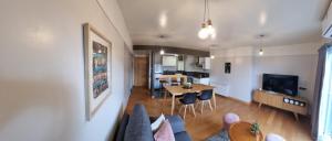 a living room with a couch and a table at UBICACION PERFECTA Y CONFORT- 5TA SECCION in Mendoza