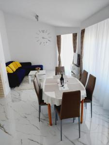 a living room with a dining table and chairs at Apartment Relax in Vir