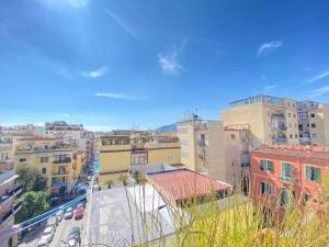 a view of a city with buildings and cars at Attico Solimena - Private Terrace cityview in Naples