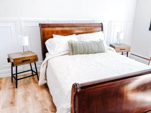 a bedroom with a large bed with two night stands at SunStar Alaska Bed and Breakfast LLC in Anchorage