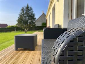 a bench with a speaker sitting on a deck at 4AS Spa Paris in Verdelot