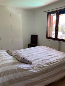 a bedroom with a bed with a pillow on it at Le Trolle in Saint-Pons