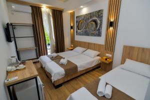 En eller flere senge i et værelse på Euro Hotel Kutaisi