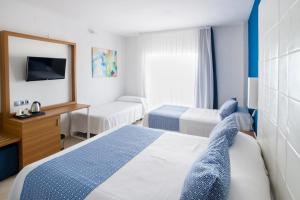 Posteľ alebo postele v izbe v ubytovaní Ibersol Torremolinos Beach