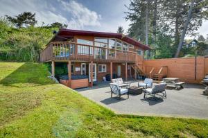 a large house with a deck and a patio at McKinleyville Getaway with Hot Tub and Ocean Views! in McKinleyville