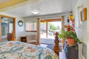 a bedroom with a bed with a plant in it at McKinleyville Getaway with Hot Tub and Ocean Views! in McKinleyville