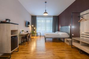 Posteľ alebo postele v izbe v ubytovaní EA ApartHotel Melantrich
