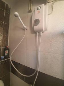 a hair dryer is attached to the wall of a bathroom at sea and mountain view roof terrace central in Alanya