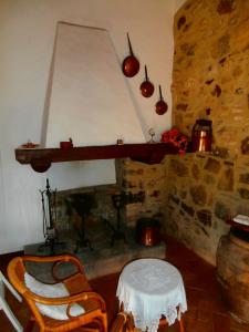 a living room with a fireplace and a table and chairs at Casa Bacci in Siena
