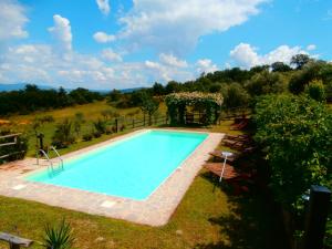 a swimming pool in the yard of a house at Casa Bacci in Siena