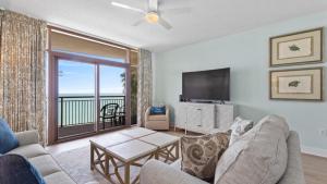 a living room with a couch and a television at North Beach Resort and Villas #1916 in Myrtle Beach