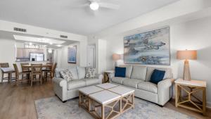 a living room with two couches and a table at North Beach Resort and Villas #1916 in Myrtle Beach