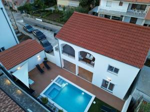 an aerial view of a house with a swimming pool at Bernie apartments with a pool in Zadar