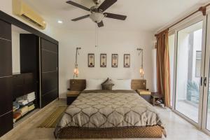 מיטה או מיטות בחדר ב-Playa Village Condo by BVR