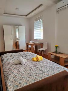 Postel nebo postele na pokoji v ubytování Karibo Apartman 2