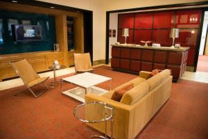 a living room with a couch and a tv at Crystal Quarters Corporate Housing at The Gramercy in Arlington