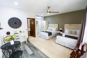 Postel nebo postele na pokoji v ubytování Hotel Siesta Holbox