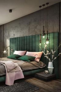 a bedroom with a large bed with a green headboard at Manoir Hamme in Hamme