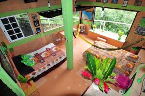 an overhead view of a room with a hammock in a house at Ecobiosfera in Catemaco