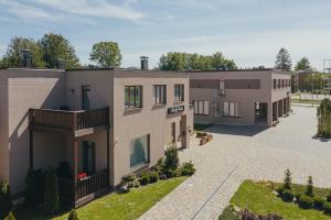 an image of a building with a courtyard at Villa Vanilla in Sigulda