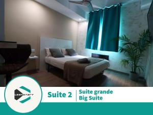 Postel nebo postele na pokoji v ubytování Carthago Suites