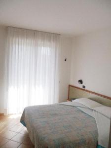 Postel nebo postele na pokoji v ubytování Hotel Prestige