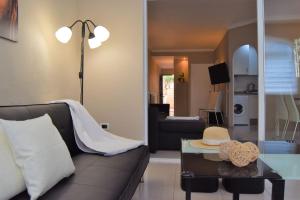 a living room with a couch and a table at CASA AVVA in San Miguel de Abona