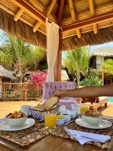 a table with food on top of a table at Villa Del Sol in Máncora
