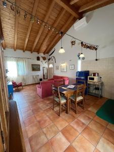 a living room with a table and chairs at Apartment-Rosella Garda in Garda