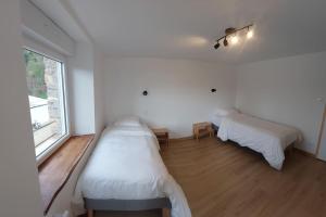 En eller flere senger på et rom på La Cigogne, moderne, spacieux et bien placé