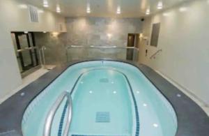 a large swimming pool in a room with at Luxe Park City Mountain Resort Studio in Park City