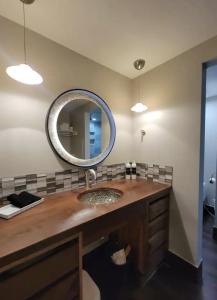 a bathroom with a sink and a mirror at Luxe Park City Mountain Resort Studio in Park City
