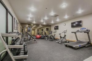 a gym with several treadmills and exercise bikes at Luxe Park City Mountain Resort Studio in Park City