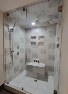 a bathroom with a shower and a sink at Luxe Park City Mountain Resort Studio in Park City