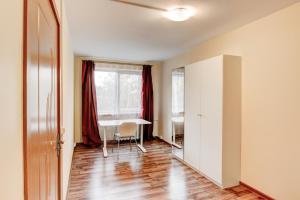 an empty room with a table and a window at Smolensko st 13 Vilnius Students Home LT in Vilnius