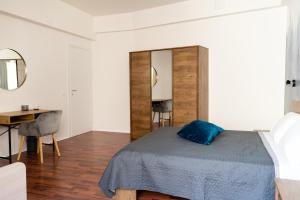 Postel nebo postele na pokoji v ubytování Alexander House Verona